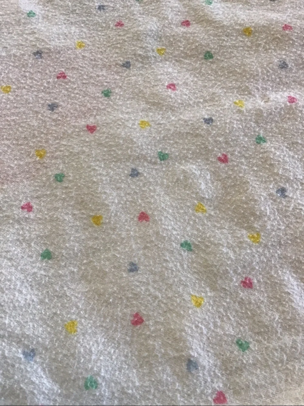 Vintage handmade baby quilt featuring embroidered teddy bears